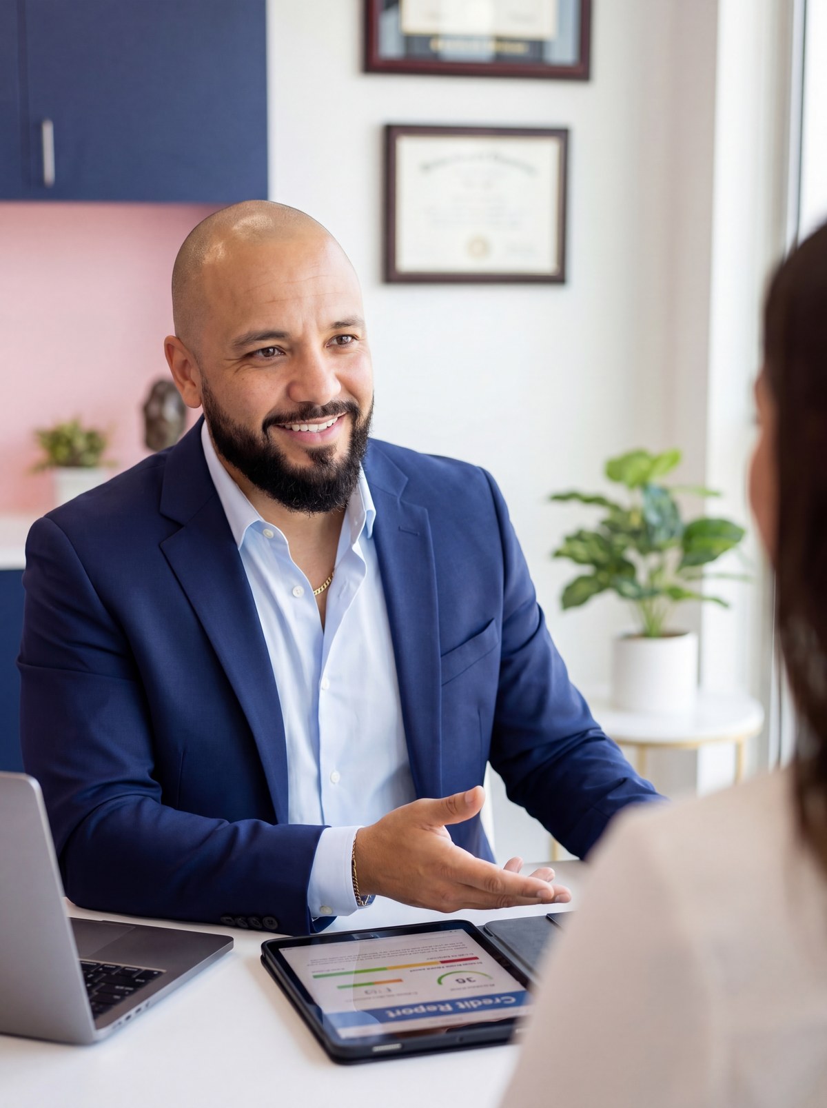 Robert Quinones reviewing credit documents with a client